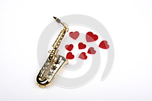 Saxophone with hearts. Flat lay, top view