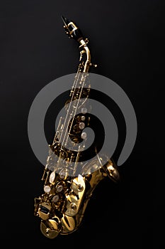 Saxophone jazz instruments. Soprano sax isolated. Saxophone music instrument closeup on black