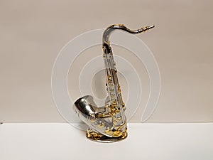 Saxophone kicked with gold photo