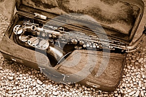 Saxophone in old leather case