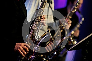 Saxophone player hands on the stage