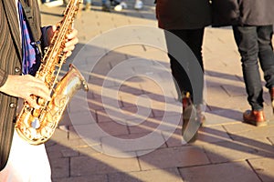 Saxophone Player and Passersby