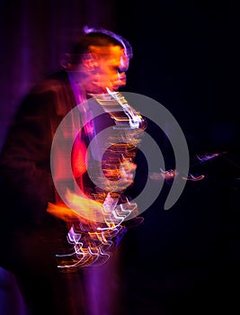 Saxophone player performing on stage