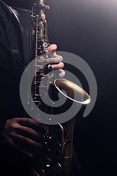 Saxophone player jazz saxophonist hands close up