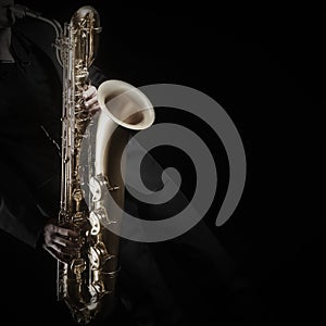 Saxophone player saxophonist with sax baritone photo