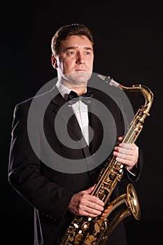 Saxophonist on a black background