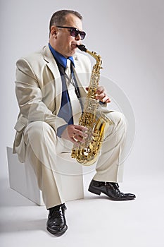 Saxophonist Caucasian soloist plays the saxophone