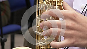 Saxophonist in dinner jacket play on golden saxophone. Live performance. Jazz music.