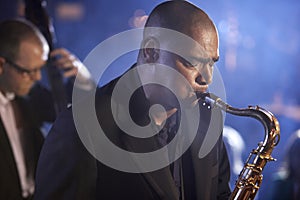 Saxophonist And Double Bass Player Performing In Jazz Club