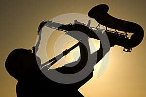 Saxophonist at dusk