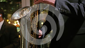 A Saxophonist Playing of Saxophone on night event. Close Up.