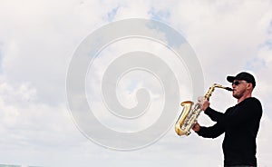 Saxophonist playing on saxophone outdoor