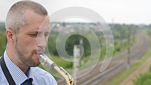 A saxophonist plays the saxophone