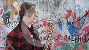 Saxophonist plays the saxophone, in winter
