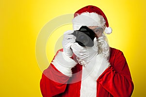 Say cheese! Santa capturing a perfect moment