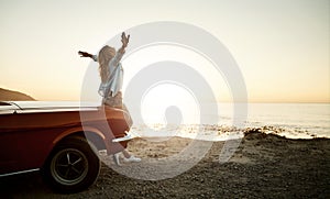 Say hello to beautiful adventures more often. a young woman enjoying a road trip along the coast.