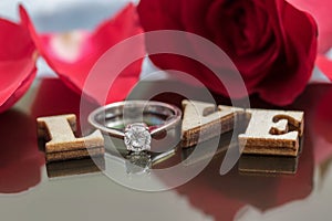 Say love via diamond ring and red rose