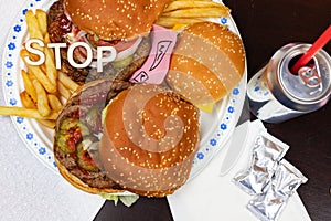 Say No To Junk Food. Juicy burger and fries with anti fast food slogan on it. Anti fast food, time for diet concept