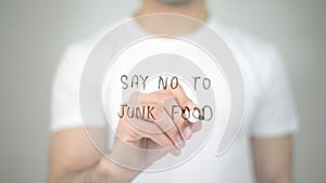 Say No to Junk Food, man writing on transparent screen