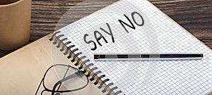 SAY NO words written in an office notebook. Concept in business