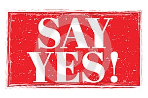 SAY YES!, words on red grungy stamp sign