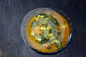 Sayur lodeh with tofu, tempeh, shrimp and vegetable filling.