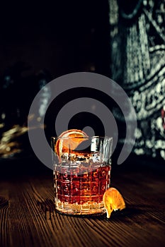 sazerac cocktail on dark wooden background with copy space