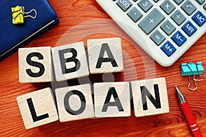 SBA loan concept. Wooden cubes with letters