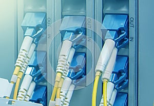 SC optical connectors plug into optical ports of telecommunication equipment node, information technology, broadband highspeed in