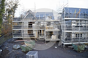 Scaffold at construction of new houses in residential building site UK