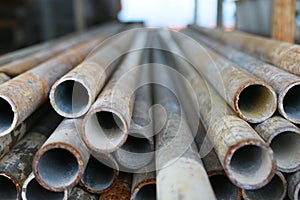 Scaffold pipe have been kept on stand or shelf for support construction job, The piping was used by scaffolder to install