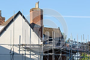 Scaffold platform erected for construction repair work on rural photo