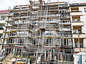 Scaffold surrounding new building completion construction