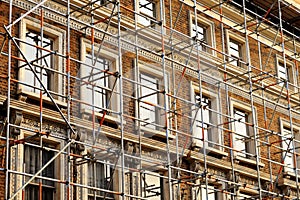 Scaffolded house wall fragment