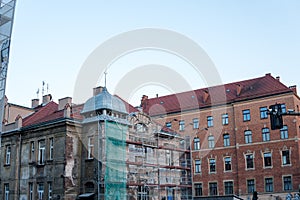 Scaffolding around a building renovating facade, restoration of old buildings. emergency building in the historic city center, the