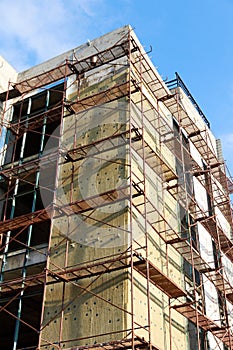 scaffolding around a multi-storey building under construction