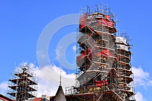 Scaffolding around multiple church spires