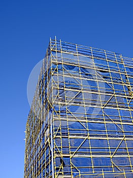 Scaffolding and Blue Safety Cladding on Construction