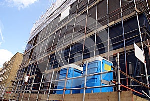 Scaffolding. construction site. portable toilets