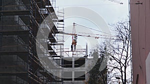Scaffolding construction workers and crane development built project engineering