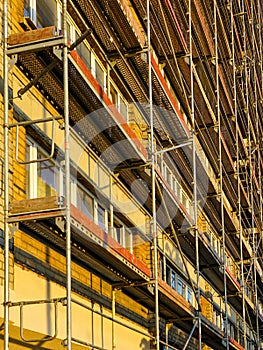 Scaffolding before installation of the thermal insulation of the facade