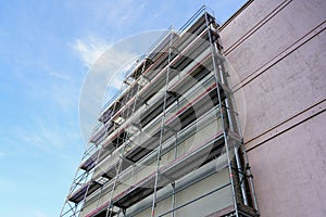Scaffolding before installation of the thermal insulation of the facade
