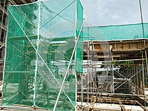 Scaffolding is installed on the construction site as temporary support for high level construction.