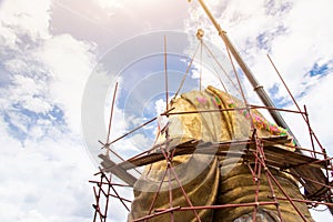 Scaffolding for rebuild or repair ancient Buddha statue in construction site,scaffold for construction