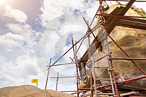 Scaffolding for rebuild or repair ancient Buddha statue in construction site,scaffold for construction