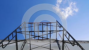 Scaffolding Steel Frame Installation in Construction townhome. clouds moving to the right.