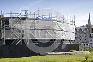 Scaffolding surrounding new house development for safe access to construction work