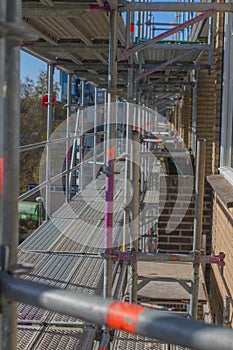 Scaffolding used as a temporary structure to support the building structure and a work platform for employees