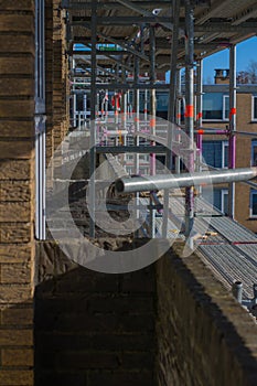 Scaffolding used as a temporary structure to support the building structure and a work platform for employees