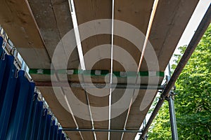 a scaffolding and wooden planks for protection and coverage on a construction site